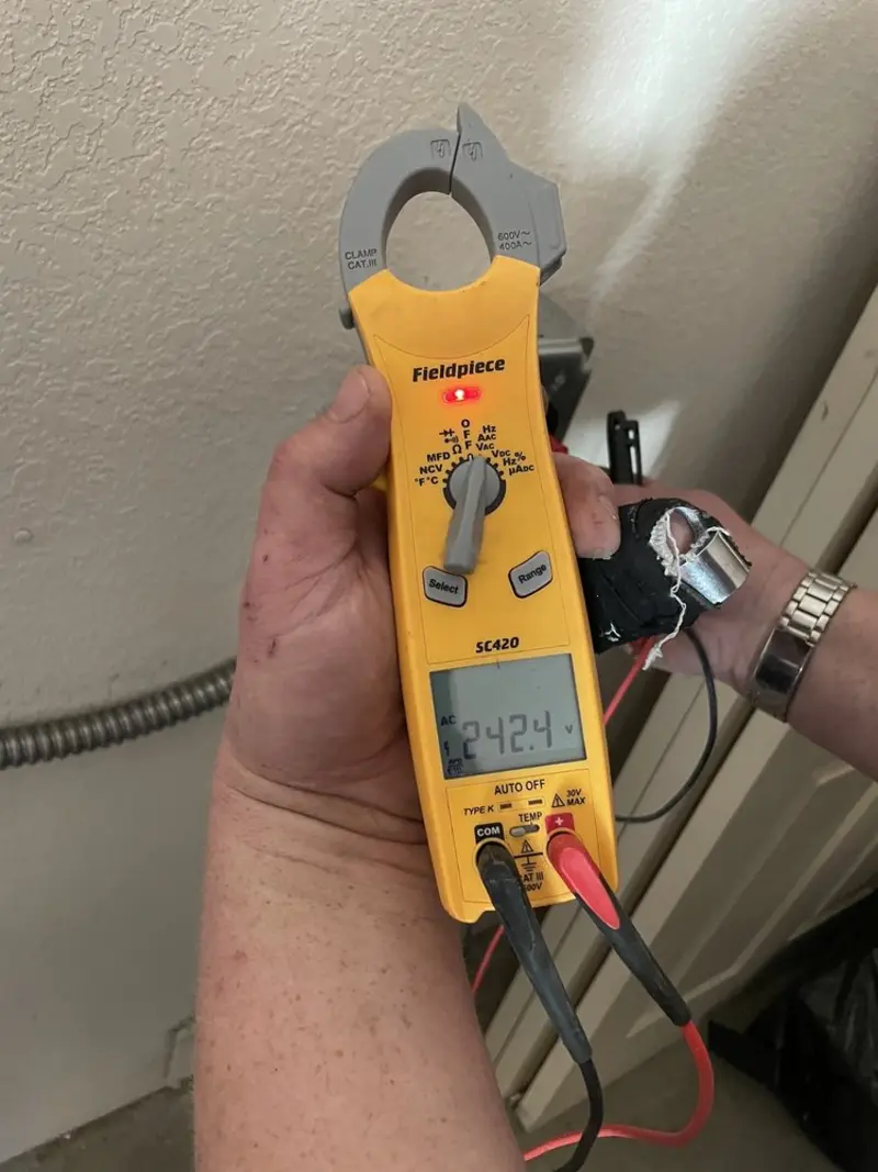 Voltage testing with clamp meter during Recessed Lighting Installation in Sleepy Hollow